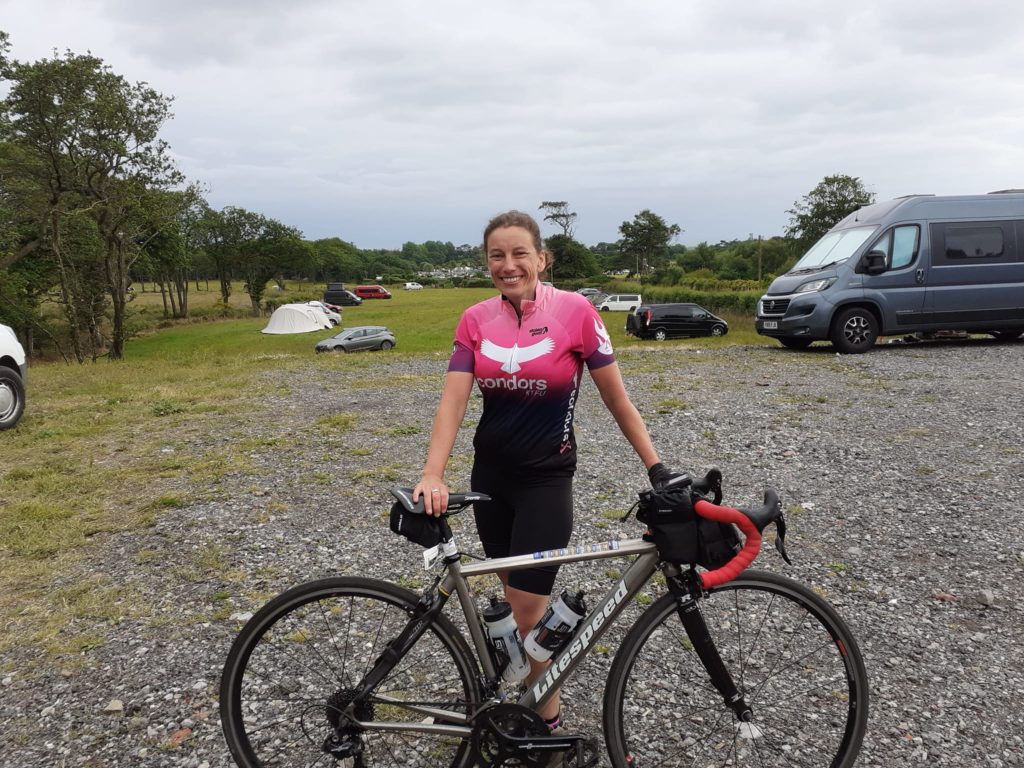 Cyclist camping on Route 4 Sustrans cycling network campsite near Swansea.